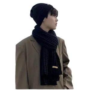 Winter warm black knitted beanie hat and chunky knit scarf set for men and women couple daily wear.