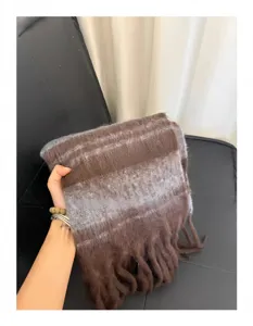 Detailed view of the fuzzy mohair wide-striped winter scarf with fringe trim, warm and soft.