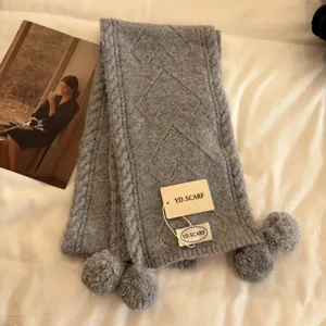 Grey knitted winter scarf with cute pom pom tassels, soft cozy cable knit warm muffler for women.