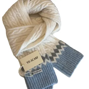 Cozy cable knit winter scarf for women, warm blue and white contrast design for cold weather.