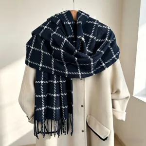 Detailed view of a stylish navy blue plaid cashmere-feel winter scarf with elegant fringes.