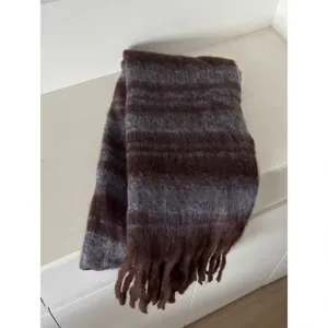 Detail view of the winter thick mohair striped scarf in brown and grey with soft fringe.