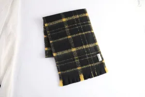 Black and yellow plaid scarf detail view, thick soft winter warm fashion neck wrap for women.