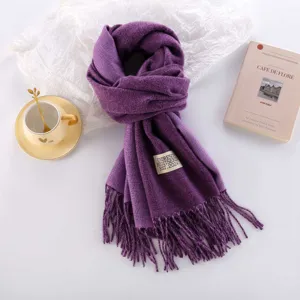 Thickened double-sided cashmere-feel scarf detail showing soft fabric texture and fringe trim.