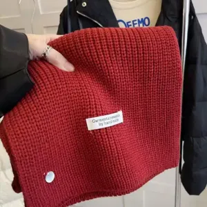 Red knitted winter scarf, cozy warmth and stylish daily wear for women and couples.
