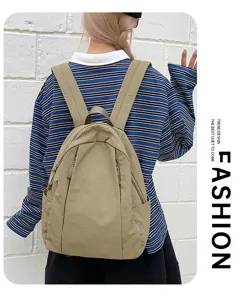 Detail view of casual solid color backpack with zipper pockets, lightweight and practical.
