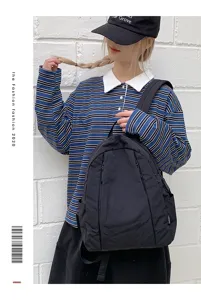 Casual black backpack for women, stylish daily school bag with multiple pockets and durable fabric.