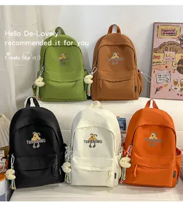 Stylish canvas student school bag with dog print, large capacity travel backpack.