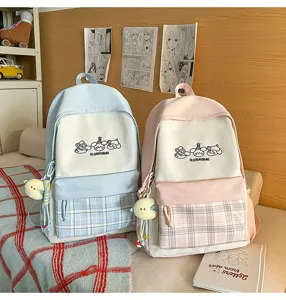 Cute Japanese ins style plaid school backpack for teenage girls students casual daily use.