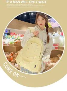 Casual canvas school backpack for women with cute embroidery, fresh college style yellow bag.