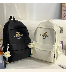 Casual canvas school backpack with cute cartoon dog print, stylish large capacity travel bag.