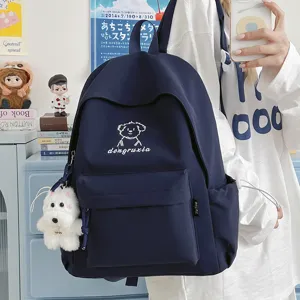 Cute Japanese style canvas school backpack with puppy embroidery and plush charm pendant.