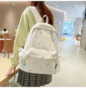 Casual canvas backpack for women cute embroidered school bookbag with plush bear pendant.
