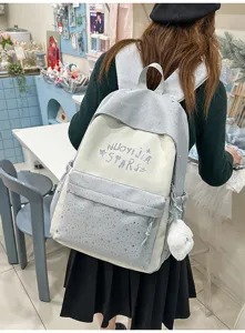Zaino scolastico bicolore in stile giapponese con stampe di stelle e tasca frontale comoda.