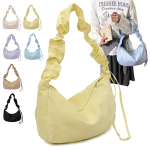 Casual pleated nylon hobo shoulder bag with large capacity, stylish dumpling tote for daily commute.