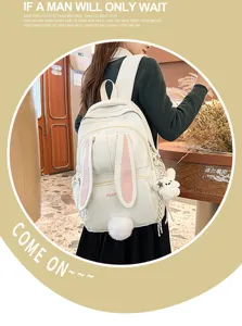 Japanese cute bunny ear backpack for school girls, casual white schoolbag with plush tail.