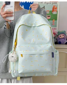 Sweet floral print casual backpack for women, lightweight canvas daypack with cute plush charm.