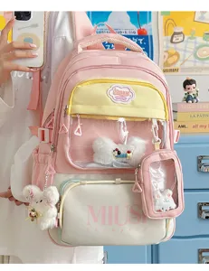 Cute Japanese style pink school backpack with transparent window and plush pendant for daily use.