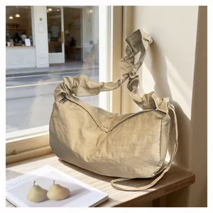 Casual nylon pleated crossbody shoulder bag large capacity stylish hobo dumpling bag for everyday commute.