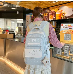 Joli sac à dos style japonais pour filles, cartable bleu décontracté avec étoiles et pendentif.
