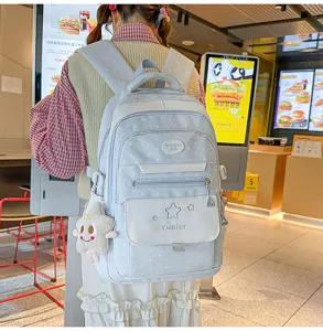 Sac à dos style école kawaii pour adolescentes, bleu clair avec étoiles et joli pendentif.