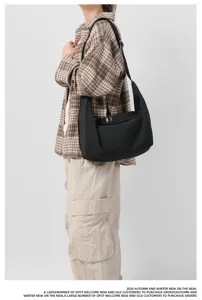 Black nylon casual crossbody bag for women, large capacity shoulder bag for daily use.