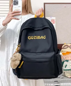 Casual black canvas backpack with yellow embroidery, versatile school bag for students daily use.