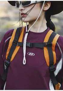 Outdoor backpack detail shot showing durable shoulder straps and chest buckle for hiking.