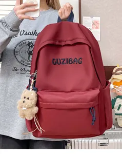 Japanese style embroidered canvas backpack for women, casual school bag with cute pendant.