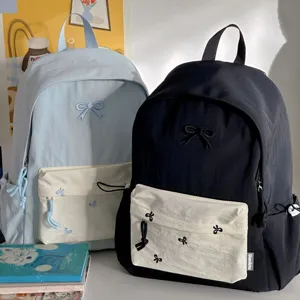 Casual canvas school backpack with cute bow embroidery, double shoulder straps for daily use.