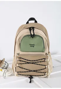 Detailed close-up of a stylish khaki and green casual backpack with multi-pocket design