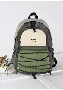Minimalist grey green multi pocket canvas backpack detail view, featuring elastic bungee cord.