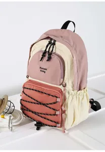Detailed view of casual contrast-color backpack featuring multi-pockets and stylish bungee cords.