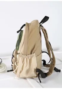 Casual canvas backpack with side pockets, spacious compartment, ideal for travel and outdoor daily use.