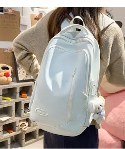 Large capacity casual backpack for women, stylish light blue school bag for daily travel and school.