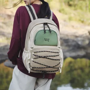 Stylish beige and green backpack for women and students, perfect for outdoor travel and daily use.