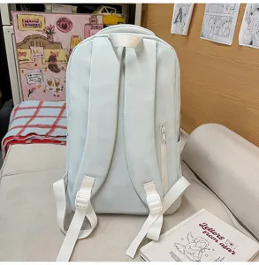 Large capacity light blue school backpack for women and students with comfortable white straps.