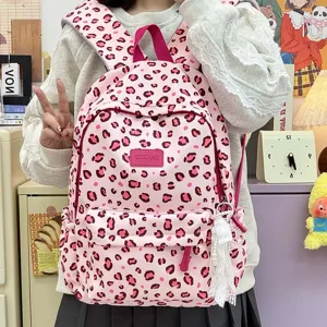 Cute Japanese pink leopard print school bag, large capacity backpack for teenage girls.