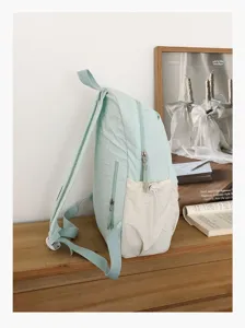 Zaino in tela verde chiaro stile coreano, borsa casual per studenti con tasca frontale.
