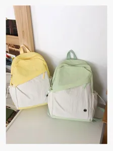 Zaino scolastico casual in tela, bel design bicolore, ideale per viaggi e uso quotidiano.