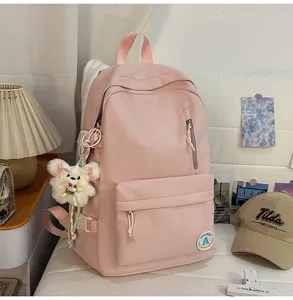 Pink Korean style casual school backpack for girls, lightweight sweet aesthetic bookbag detail.