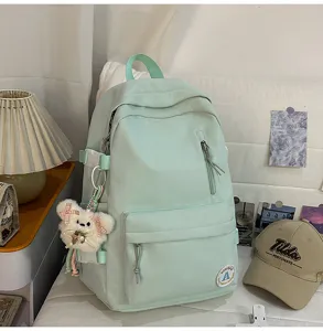Mint green college backpack for girls, cute candy color casual school bag for daily use.