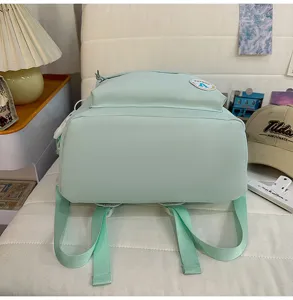Mint green casual student backpack with sweet candy color, stylish college style for daily use.