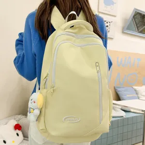 Large capacity yellow student backpack casual travel school bag for women daily use.