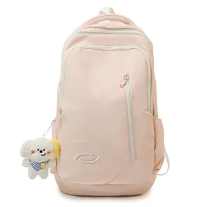 Pink large capacity school backpack for college and high school students with cute dog pendant.