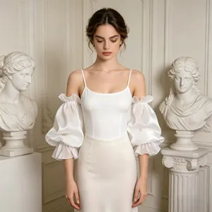 Detachable sheer mesh bubble sleeves and white camisole top, elegant apparel detail.