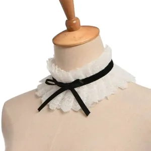 Vintage lace fake collar with black velvet bow, elegant Victorian choker accessory for women.