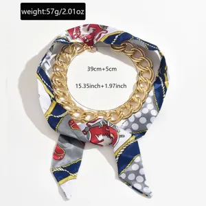 Chunky gold chain necklace interwoven with multi-color printed silk scarf elegant.