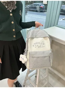 Zaino stile giapponese color block per studenti borsa scolastica capiente con ciondolo.