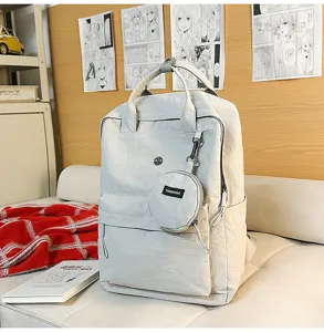 Lässiger minimalistischer grauer Rucksack mit kleiner runder Tasche für Studenten